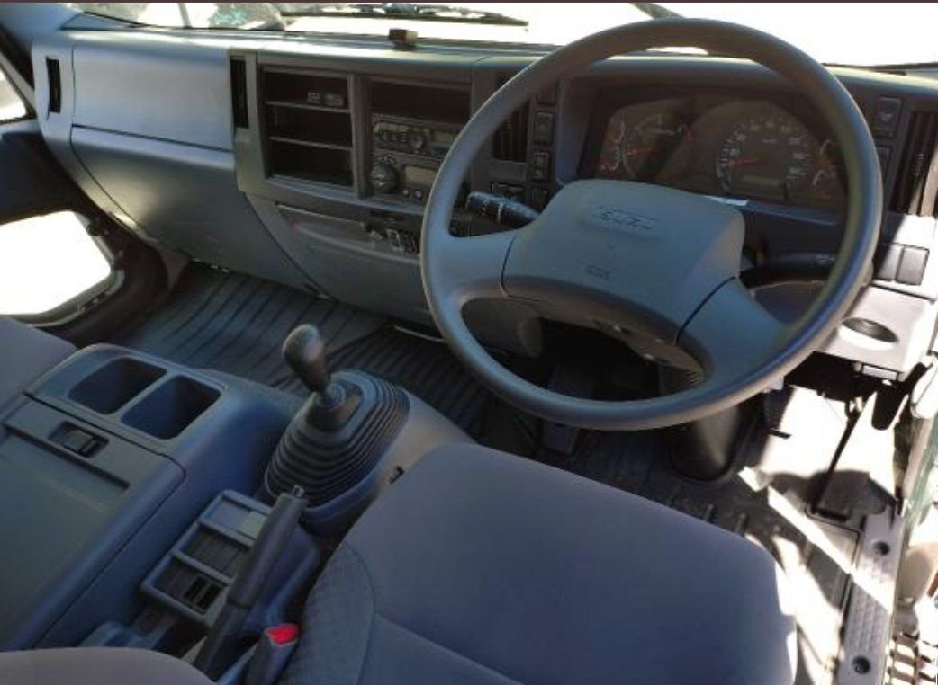 Right-hand-drive cab interior and steering wheel