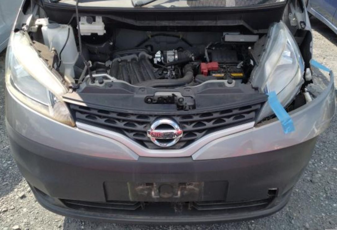 Engine bay with the front bumper loose on the left