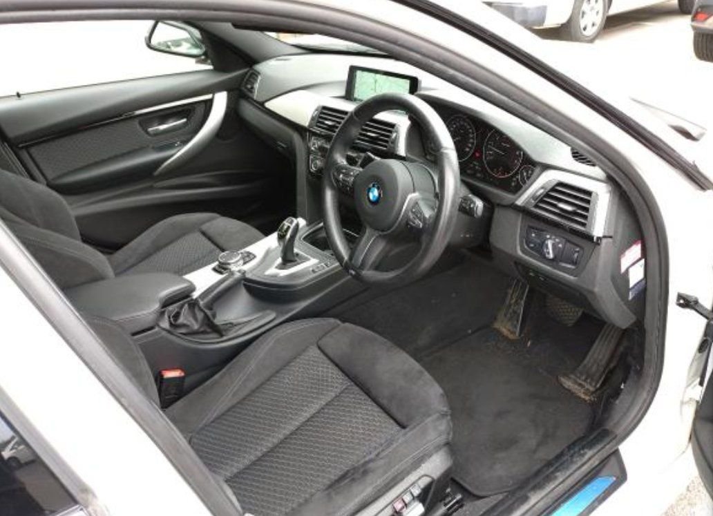 Right-hand-drive cockpit with M Sport steering wheel and seats