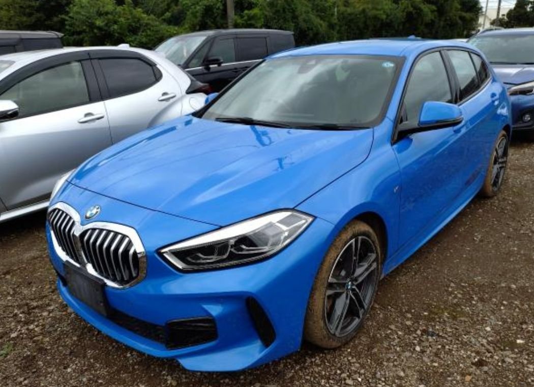 Blue BMW 118i M Sport seen from the front left