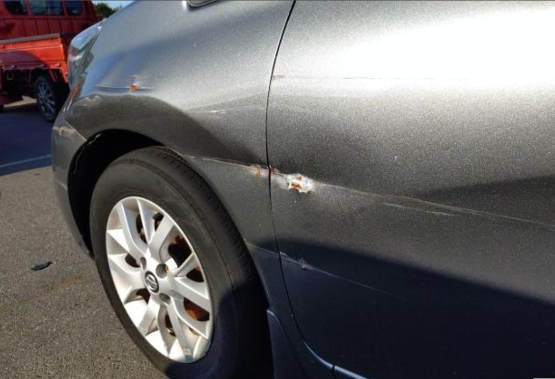 Close-up of the side-swipe damage on the right side