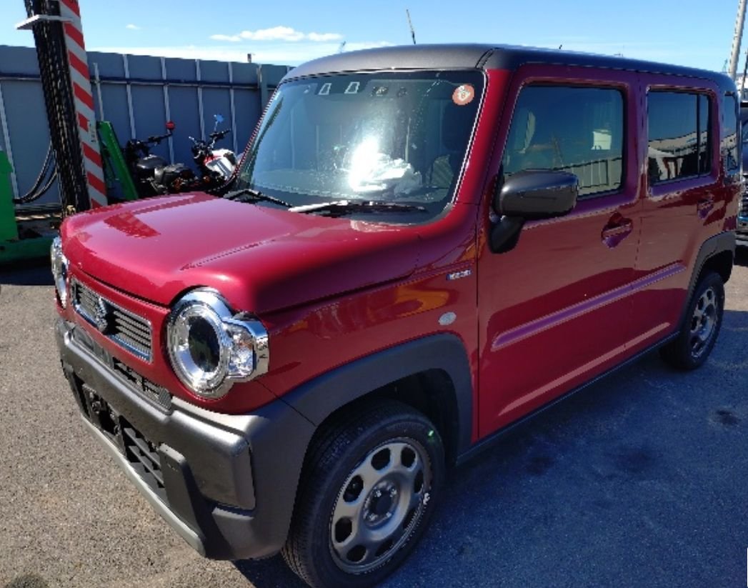 Red Suzuki Hustler seen from the front left