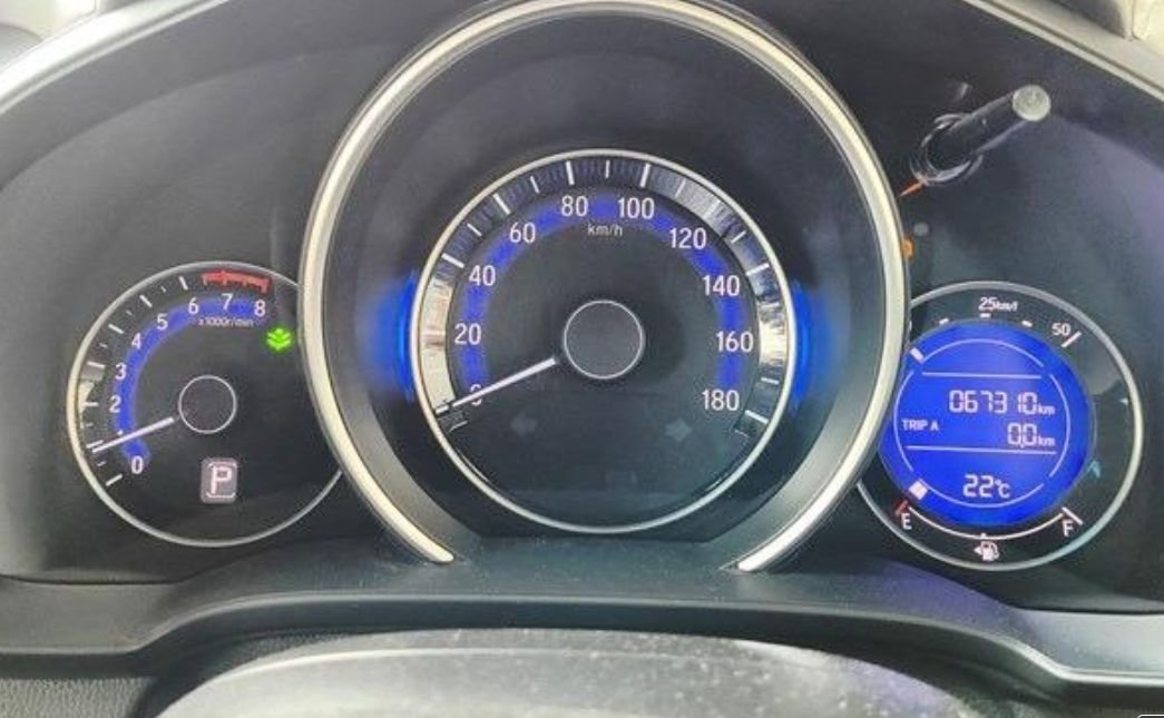 Instrument cluster showing 67,310 km