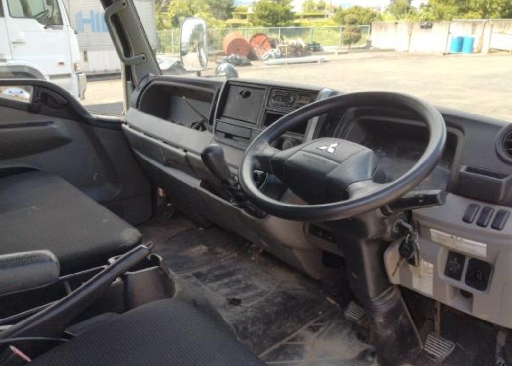 Right-hand-drive cab interior and steering wheel
