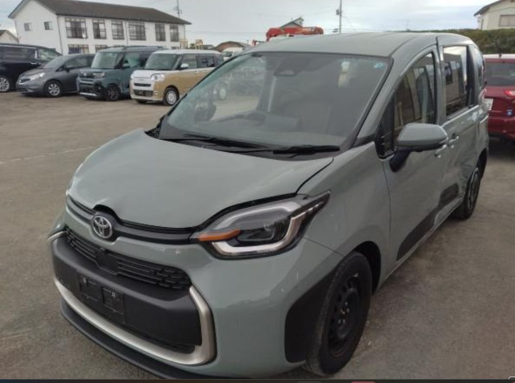 Green-grey Toyota Sienta seen from the front left