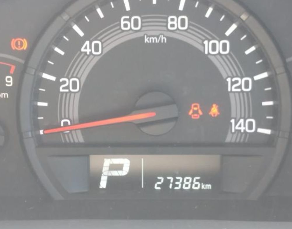 Instrument cluster showing 27,386 km