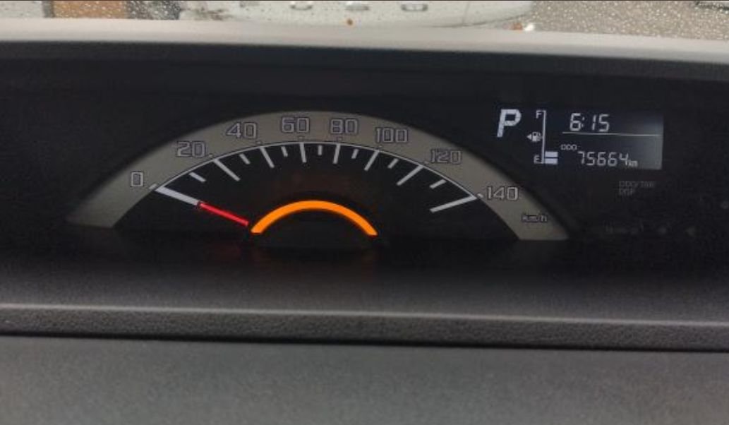 Instrument cluster showing 75,664 km