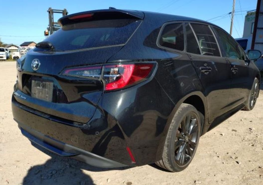 Rear right of the Corolla Touring with a dent on the rear bumper