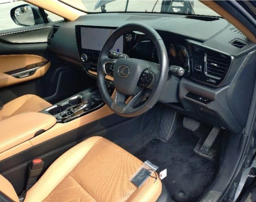 Tan leather front seats and right-hand-drive cockpit