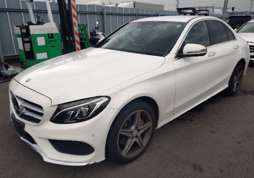 White Mercedes-Benz C220d sedan seen from the front left