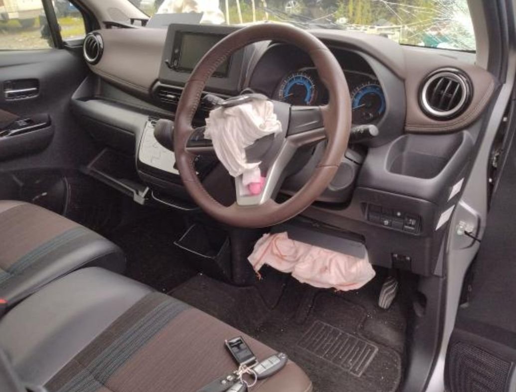 Right-hand-drive interior with deployed airbags