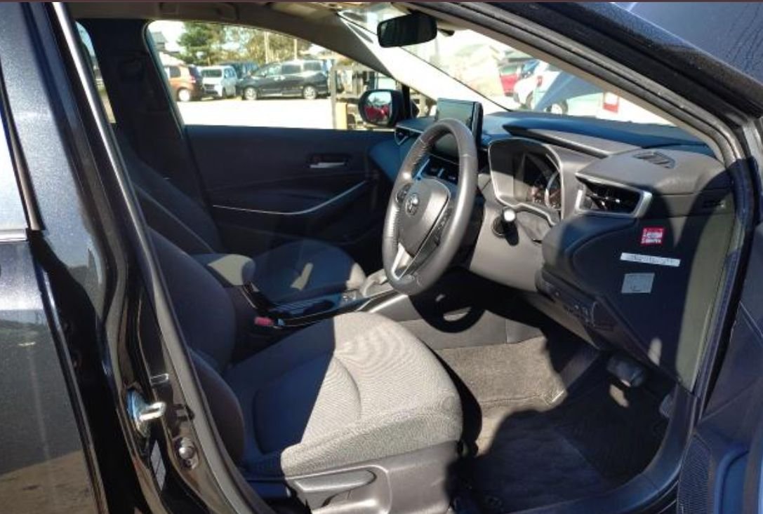 Right-hand-drive interior with clean fabric seats