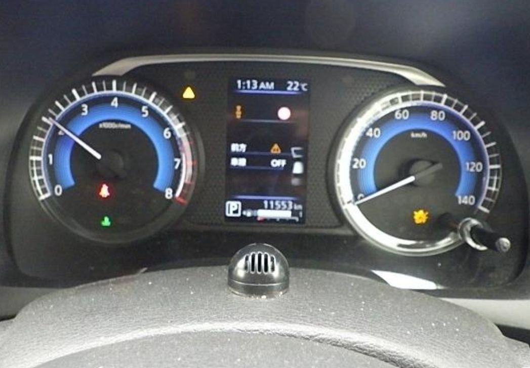 Instrument cluster showing 11,553 km