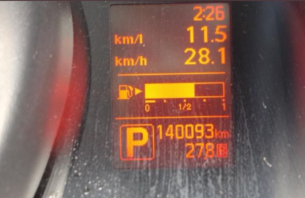 Instrument display showing 140,093 km