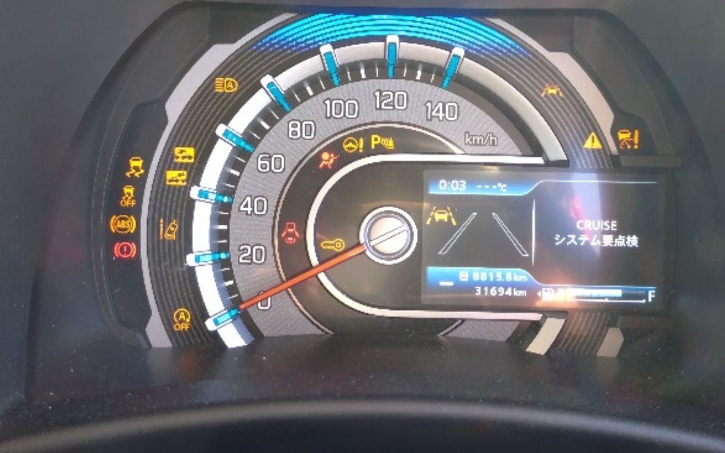 Instrument cluster showing 31,694 km