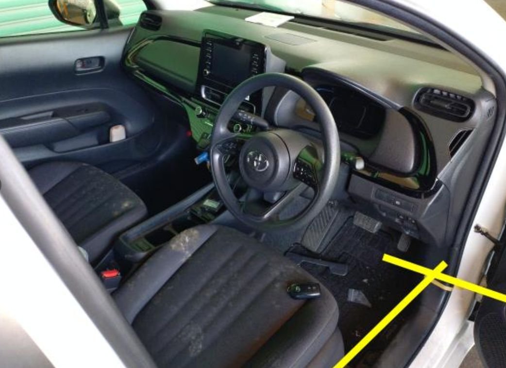 Right-hand-drive interior with dirt on the seats