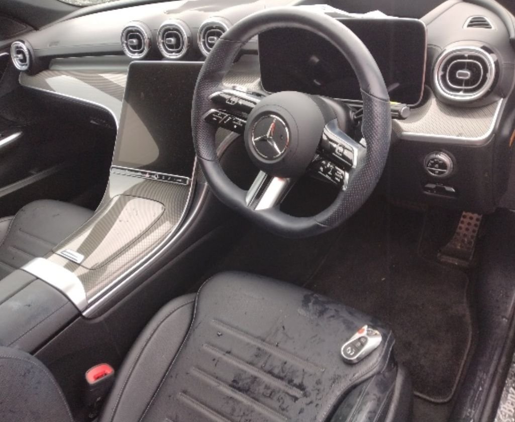 Right-hand-drive interior with mud on the driver's seat