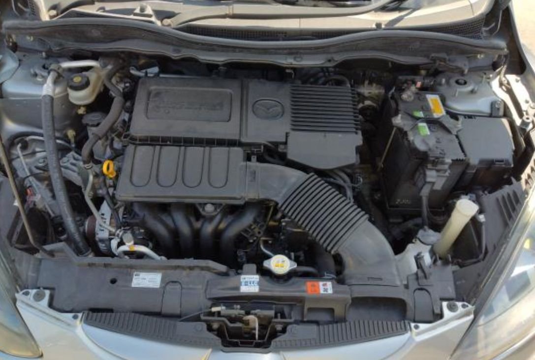 Engine bay of the Mazda Demio